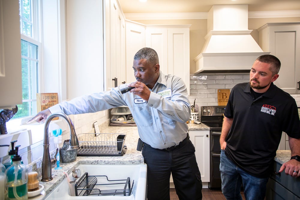 pest control expert inspects inside of home