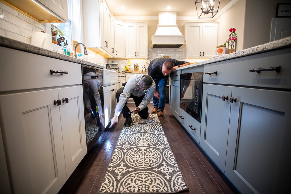 pest control expert inspects interior of home