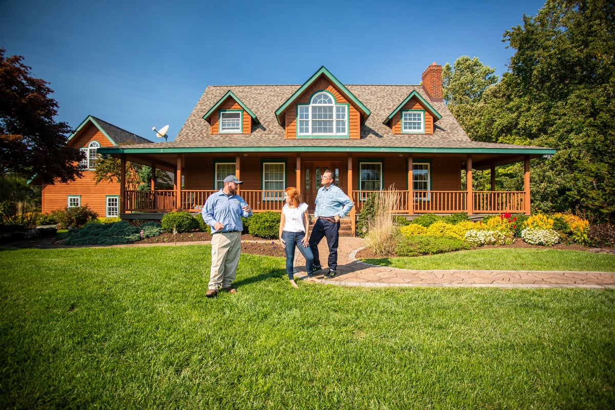 customers meet with lawn care expert