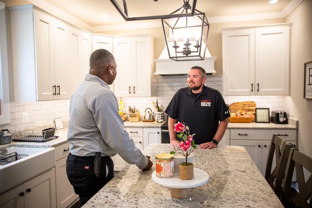 Pest Control technician discussing carpenter ants with customer