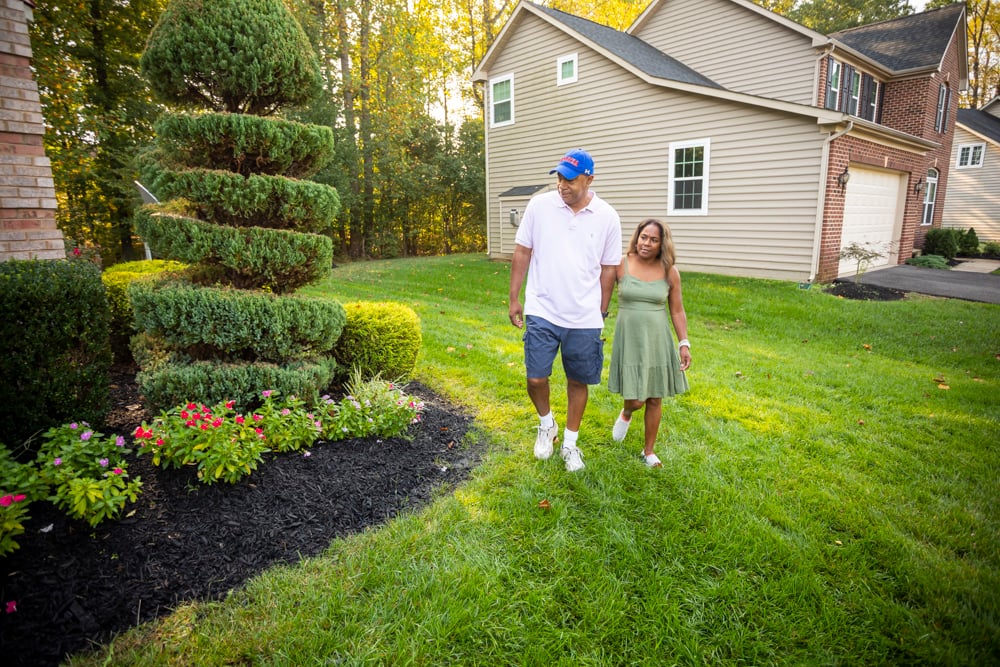 happy lawn care customers in Maryland yard