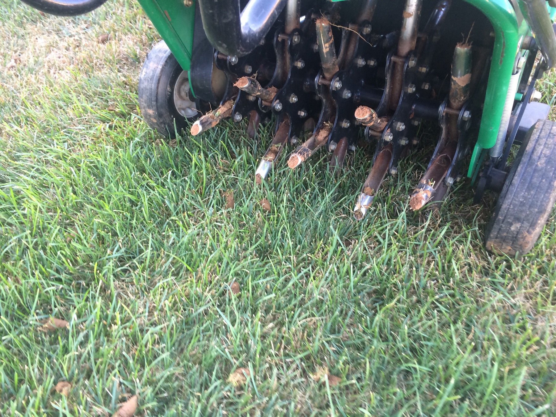 Core aeration for a lush green lawn