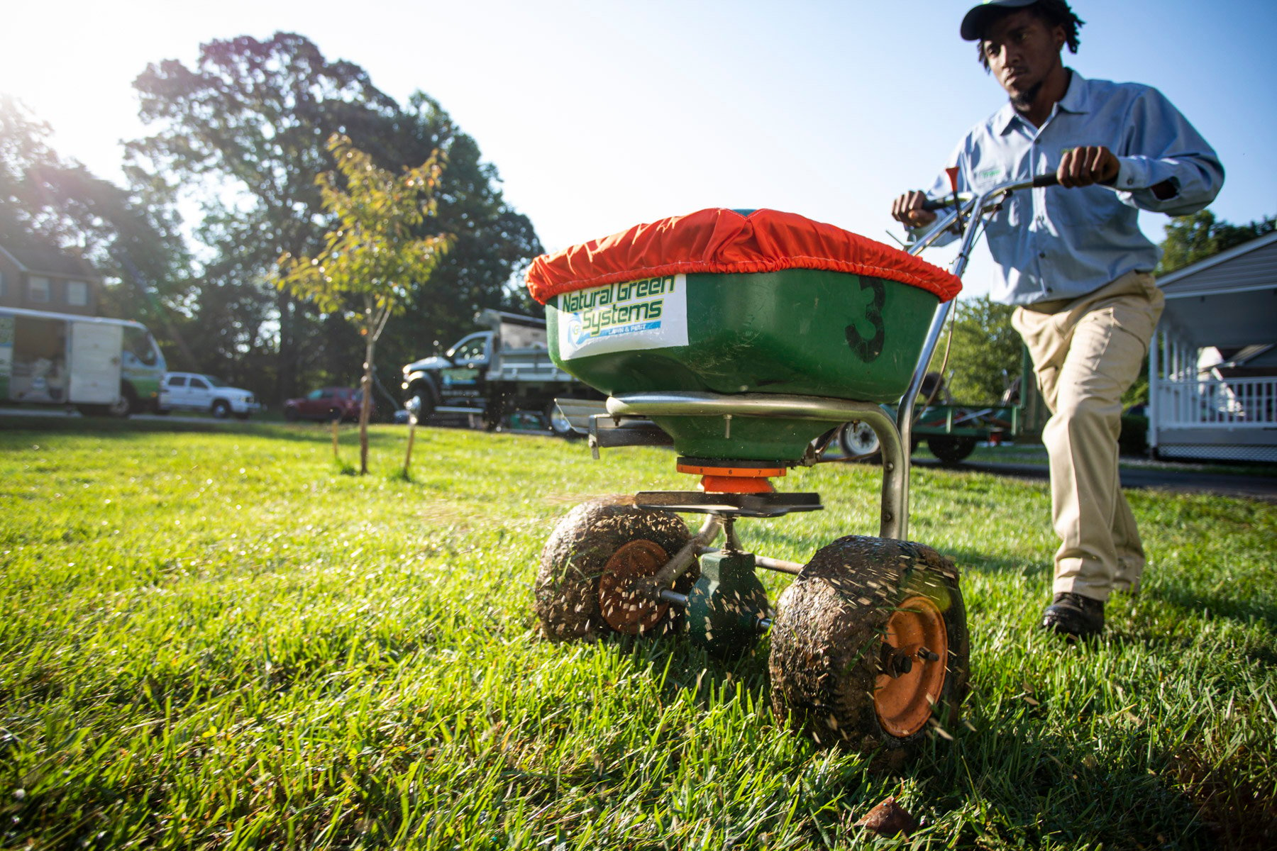 lawn care technician overseeding lawn