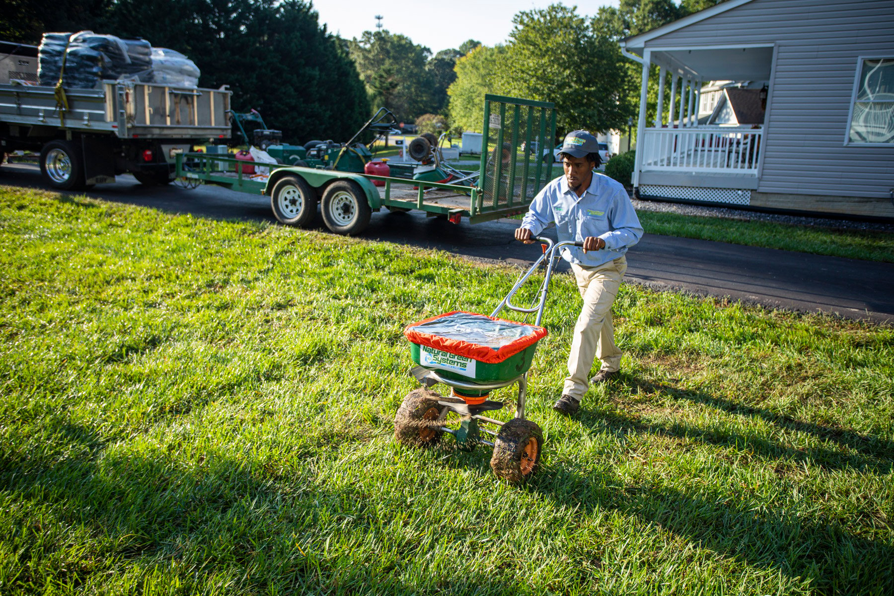 NaturalGreen technician overseeding grass