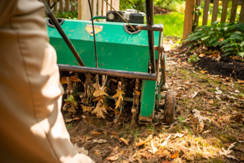 aeration machine aerates dirt and lawn